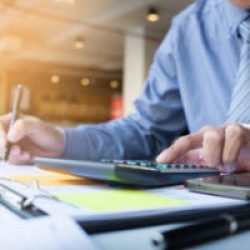 Business finance man calculating budget numbers, Invoices and financial adviser working.